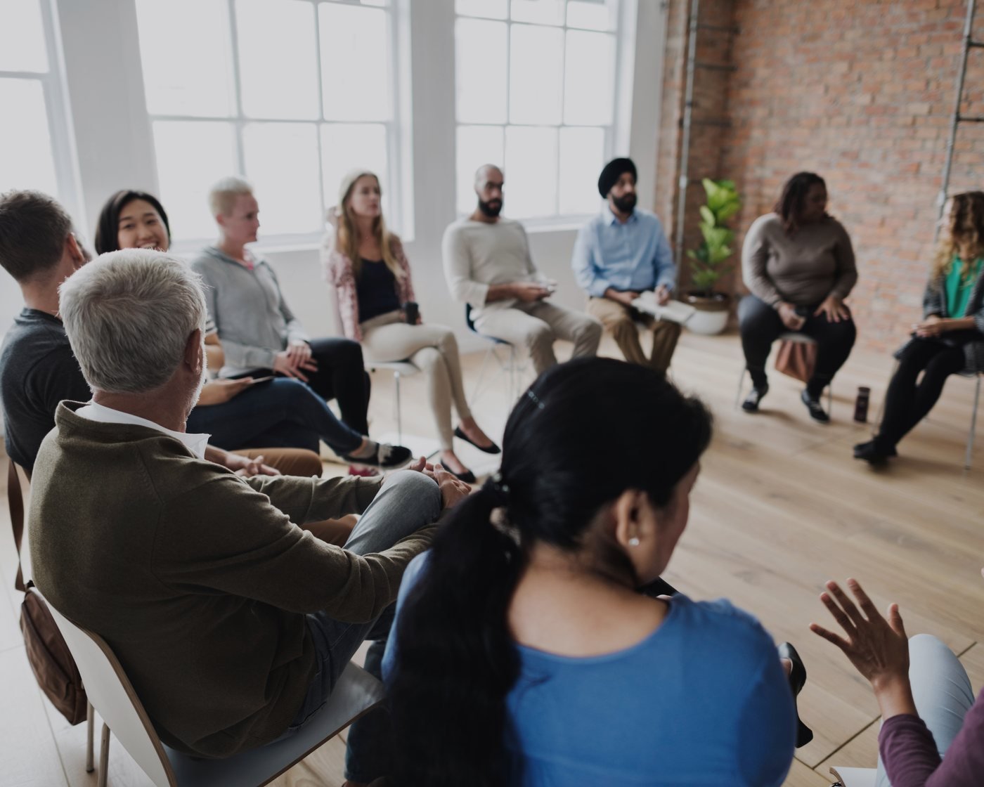 A workshop in progress, a room of people in discussion